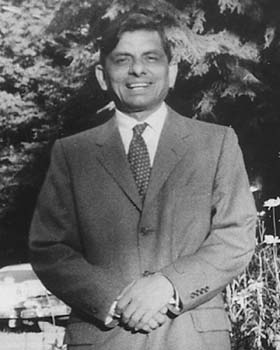 Swami in suit standing